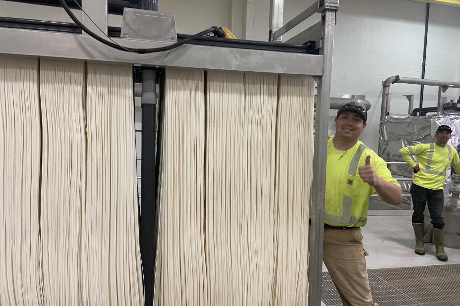 Photo of worker installing new membranes