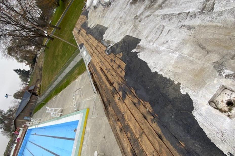 Photo of damage to bathhouse roof